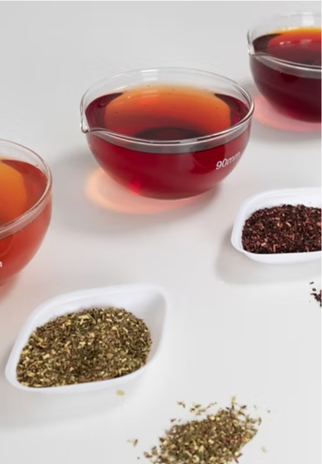 Red and Green Rooibos Extract in ceramic bowls